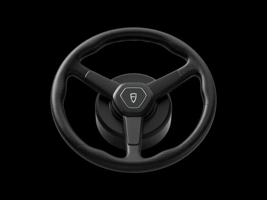 Il volante elettrico di guida automatica FJDynamics visto di fronte, con il marchio al centro